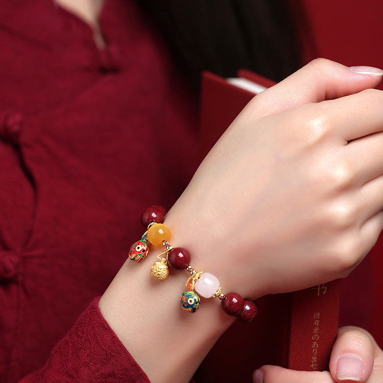 Elegant Red Cinnabar Bracelet with Cloisonné Golden Beasts Trio, White Jade, Yellow Amber, and 18K Gold Accents