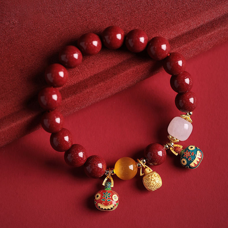 Elegant Red Cinnabar Bracelet with Cloisonné Golden Beasts Trio, White Jade, Yellow Amber, and 18K Gold Accents